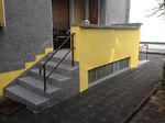 Hürth: Terrasse mit Stufen mit Steinteppich beschichtet: